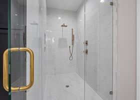 Minimalist bathroom with brushed-gold Cleanote fixtures